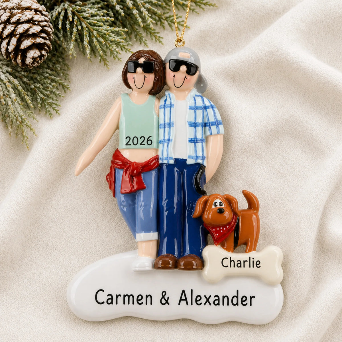 Personalized cool couple with brown dog christmas ornament laid on a soft white knit blanket