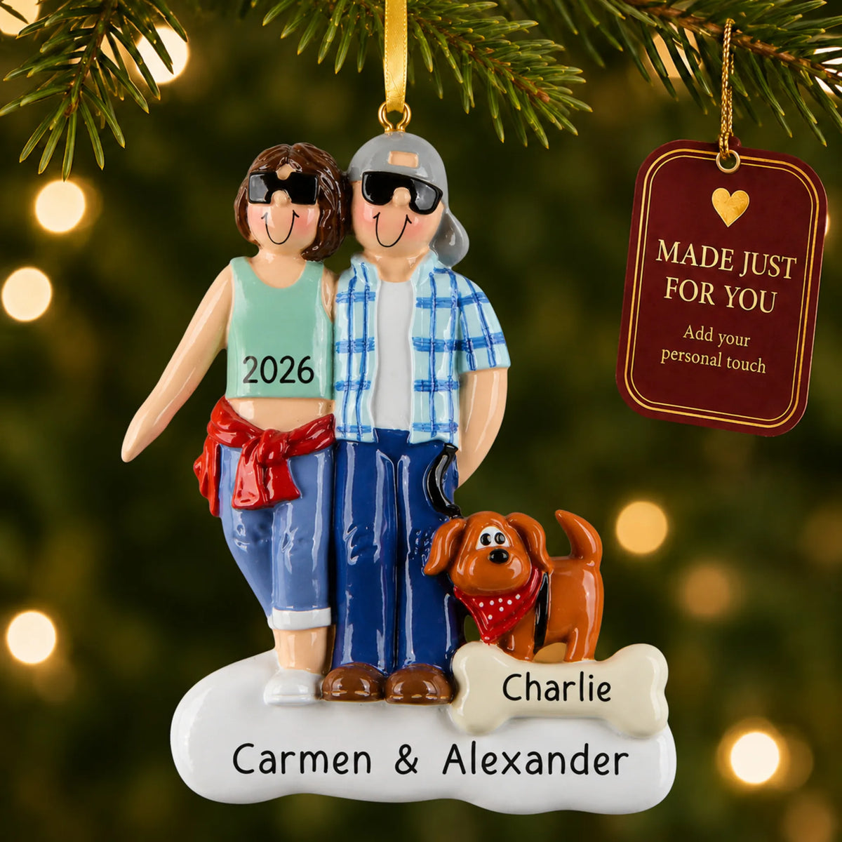 Cool couple with brown dog christmas ornament hanging on a lit Christmas tree with a Made Just For You gift tag