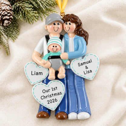 Personalized new parents with baby christmas ornament laid on a soft white knit blanket