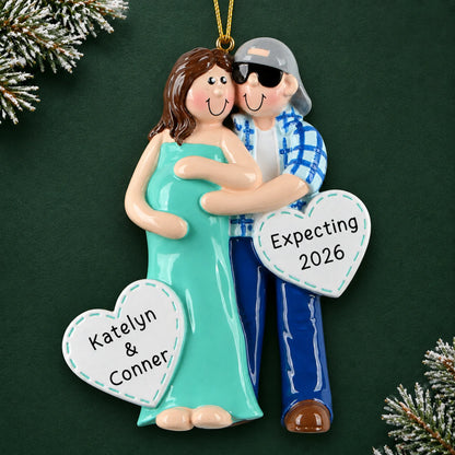 Personalized Expecting Couple christmas ornament on a dark green pine background