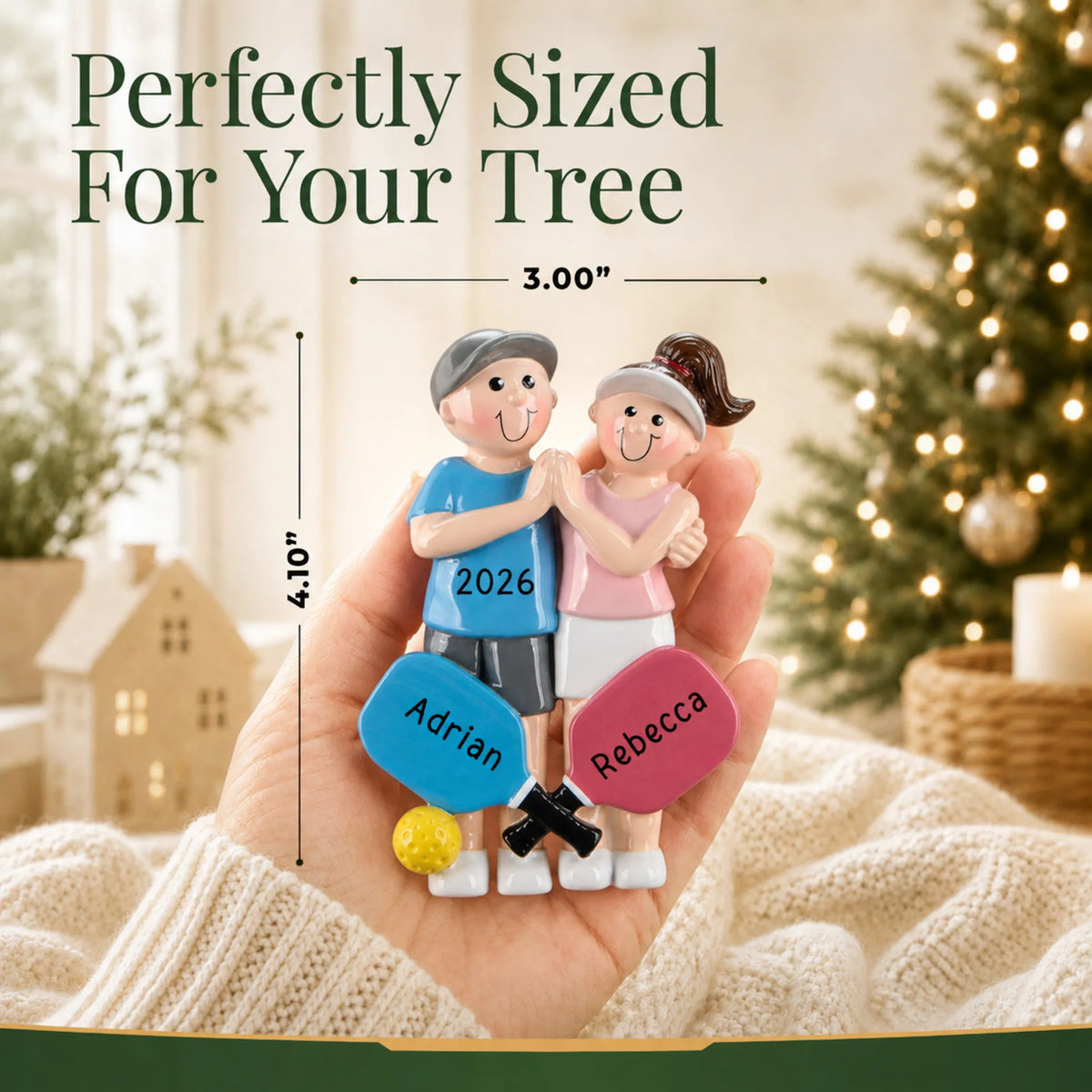 Size guide: the personalized pickleball couple christmas ornament shown in hand next to a Christmas tree