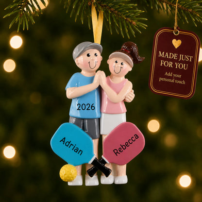 Pickleball couple christmas ornament hanging on a lit Christmas tree with a Made Just For You gift tag