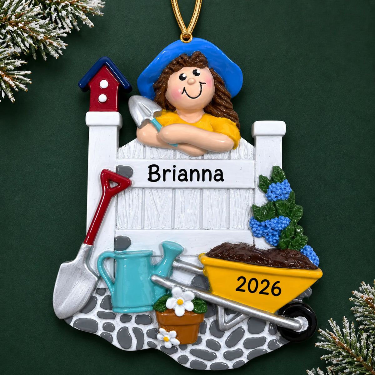Personalized woman gardener christmas ornament on a dark green pine background