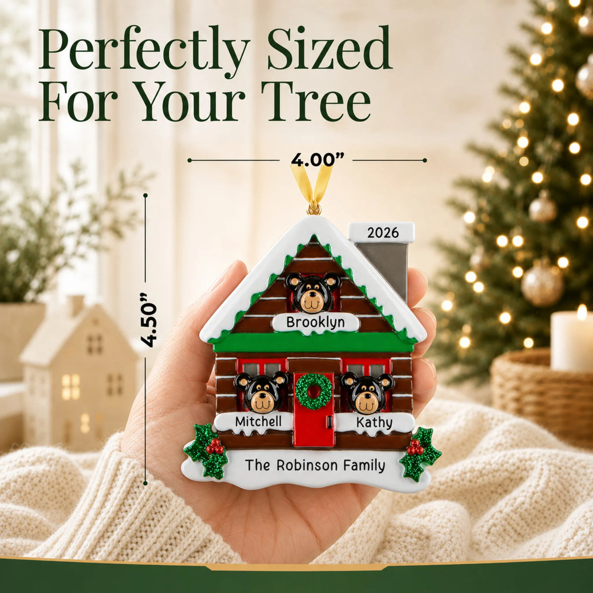 Size guide: the personalized mountain cabin family of 3 christmas ornament shown in hand next to a Christmas tree