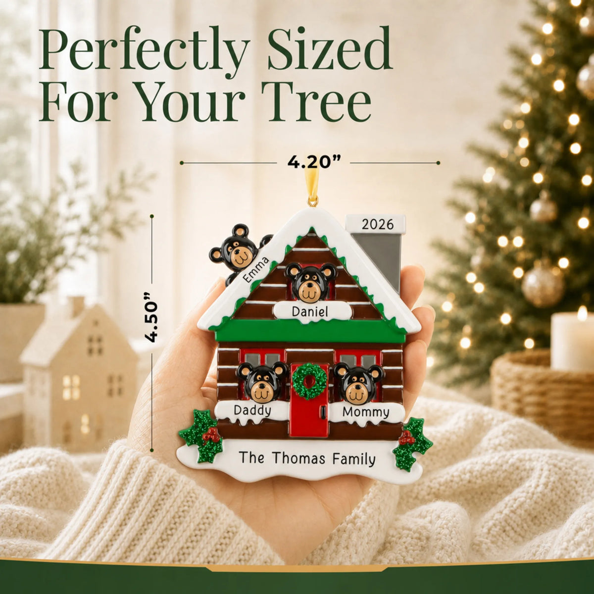 Size guide: the personalized mountain cabin family of 4 christmas ornament shown in hand next to a Christmas tree