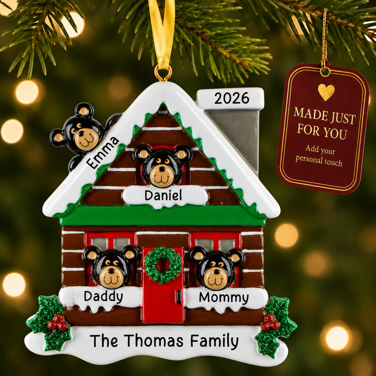 Mountain cabin family of 4 christmas ornament hanging on a lit Christmas tree with a Made Just For You gift tag