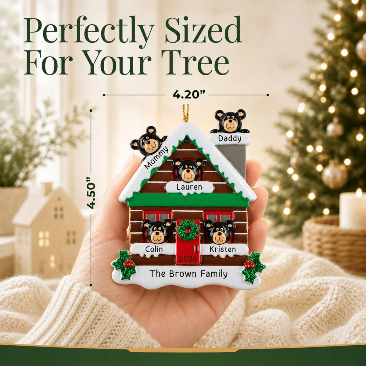 Size guide: the personalized mountain cabin family of 5 christmas ornament shown in hand next to a Christmas tree