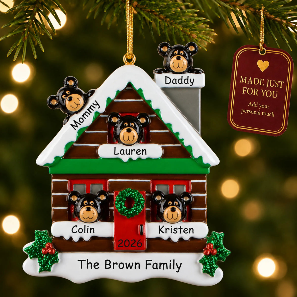 Personalized mountain cabin family of 5 christmas ornament hanging on a lit tree beside a Made Just For You tag