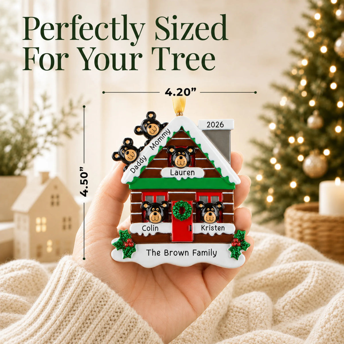 Size guide: the personalized mountain cabin family of 5 christmas ornament shown in hand next to a Christmas tree