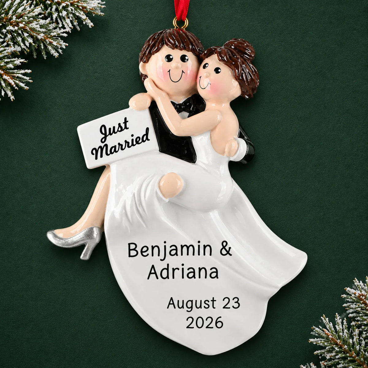 Personalized Just Married Bride & Groom christmas ornament on a dark green pine background