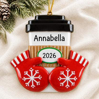 Personalized Coffee / Hot Cocoa Cup christmas ornament laid on a soft white knit blanket