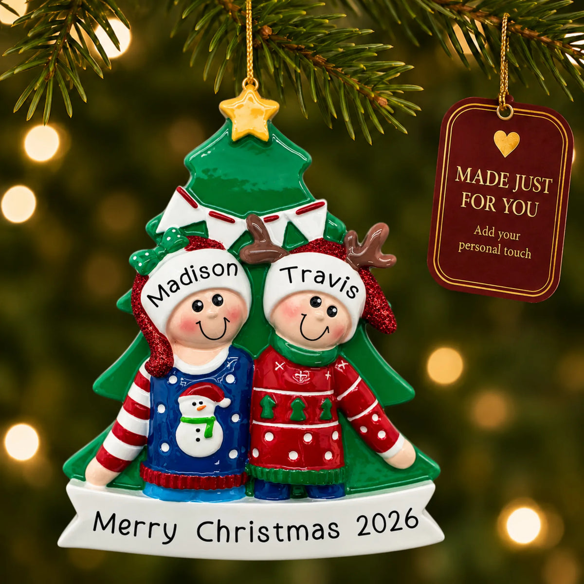 Ugly sweater holiday couple christmas ornament hanging on a lit Christmas tree with a Made Just For You gift tag
