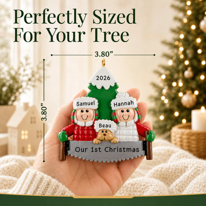Size guide: the personalized outdoor couple with dog christmas ornament shown in hand next to a Christmas tree