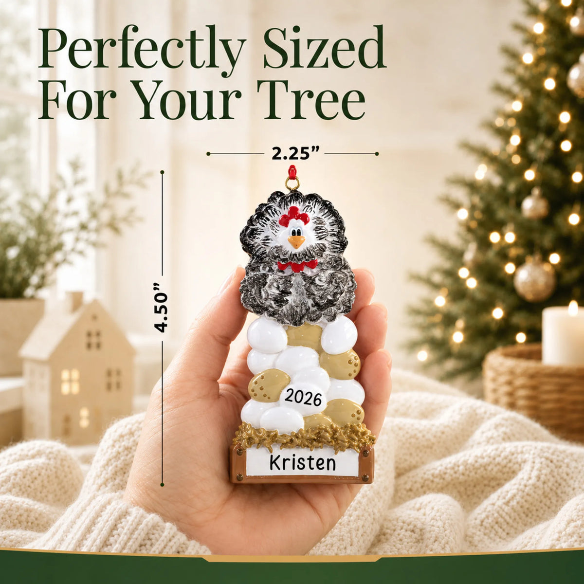Size guide: the personalized chicken laying eggs christmas ornament is 2.25 in wide by 4.50 in tall, shown in hand