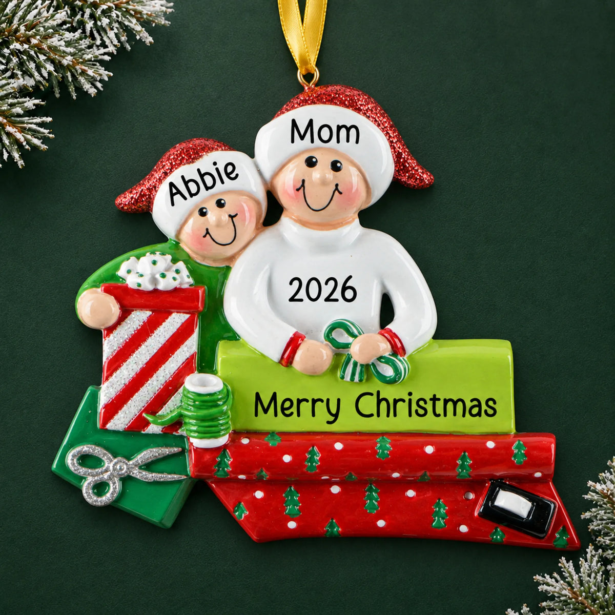 Personalized single parent & child christmas ornament on a dark green pine background