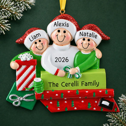Personalized single parent & 2 children christmas ornament on a dark green pine background