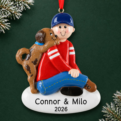 Personalized Boy With Puppy christmas ornament on a dark green pine background