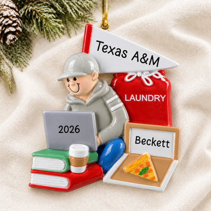 Personalized college dorm guy christmas ornament laid on a soft white knit blanket