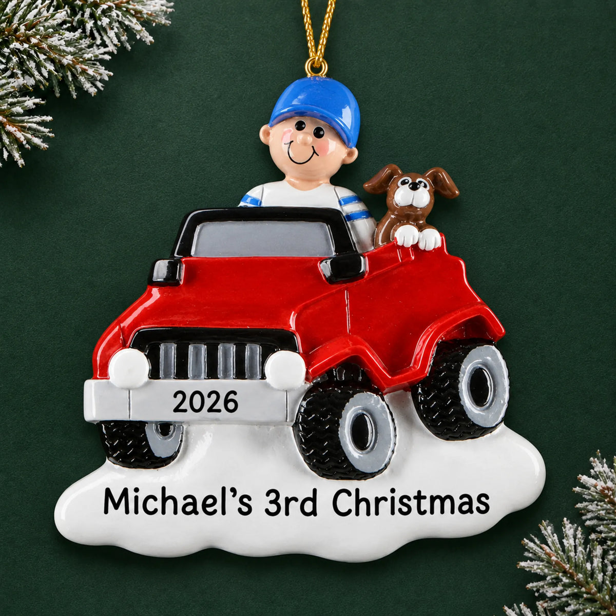 Personalized boys ride on electric car christmas ornament on a dark green pine background