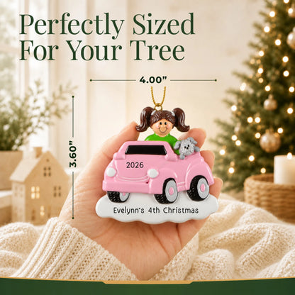 Size guide: the personalized girls ride on electric car christmas ornament is 4.00 in wide by 3.60 in tall, shown in hand