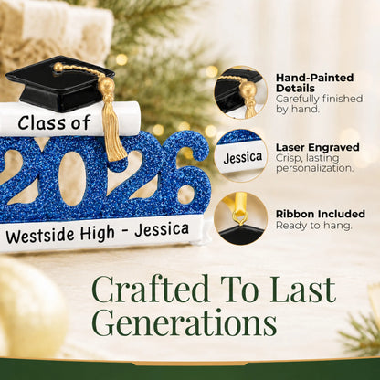 Close-up of the Class of 2026 blue graduation ornament's hand-painted details, laser-engraved banner and hanging ribbon