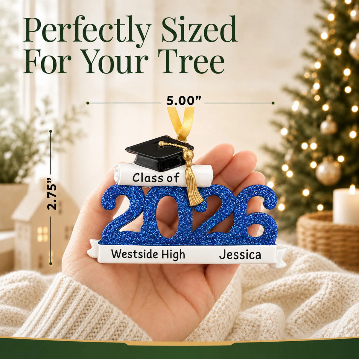 Personalized Class of 2026 blue graduation Christmas ornament held in hand, about 5 by 2.75 inches for the tree