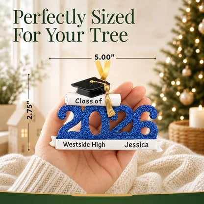 Personalized Class of 2026 blue graduation Christmas ornament held in hand, about 5 by 2.75 inches for the tree