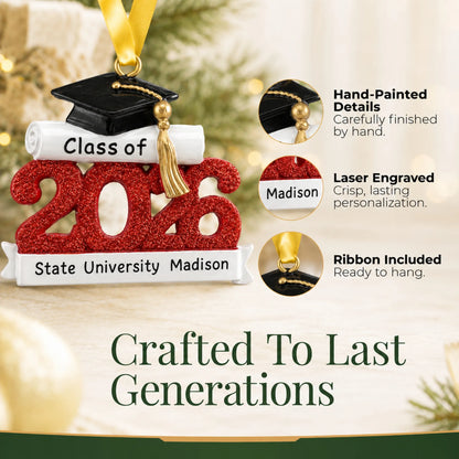 Close-up of the Class of 2026 red graduation ornament's hand-painted details, laser-engraved banner and hanging ribbon