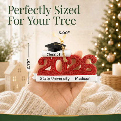 Personalized Class of 2026 red graduation Christmas ornament held in hand, about 5 by 2.75 inches for the tree