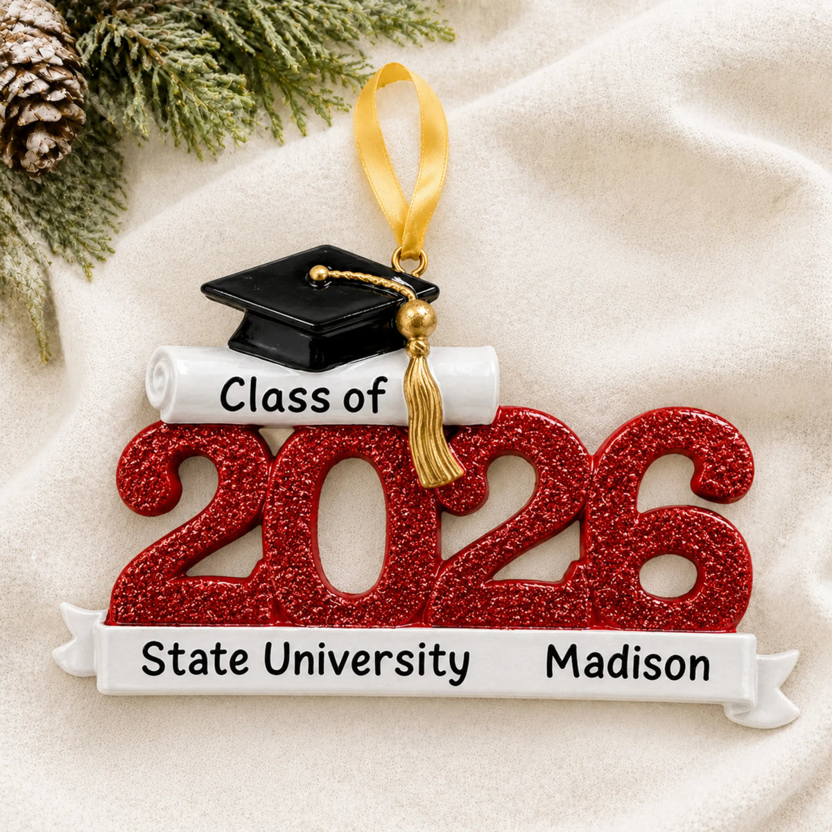 Front view of the personalized Class of 2026 red graduation Christmas ornament with grad cap and school banner