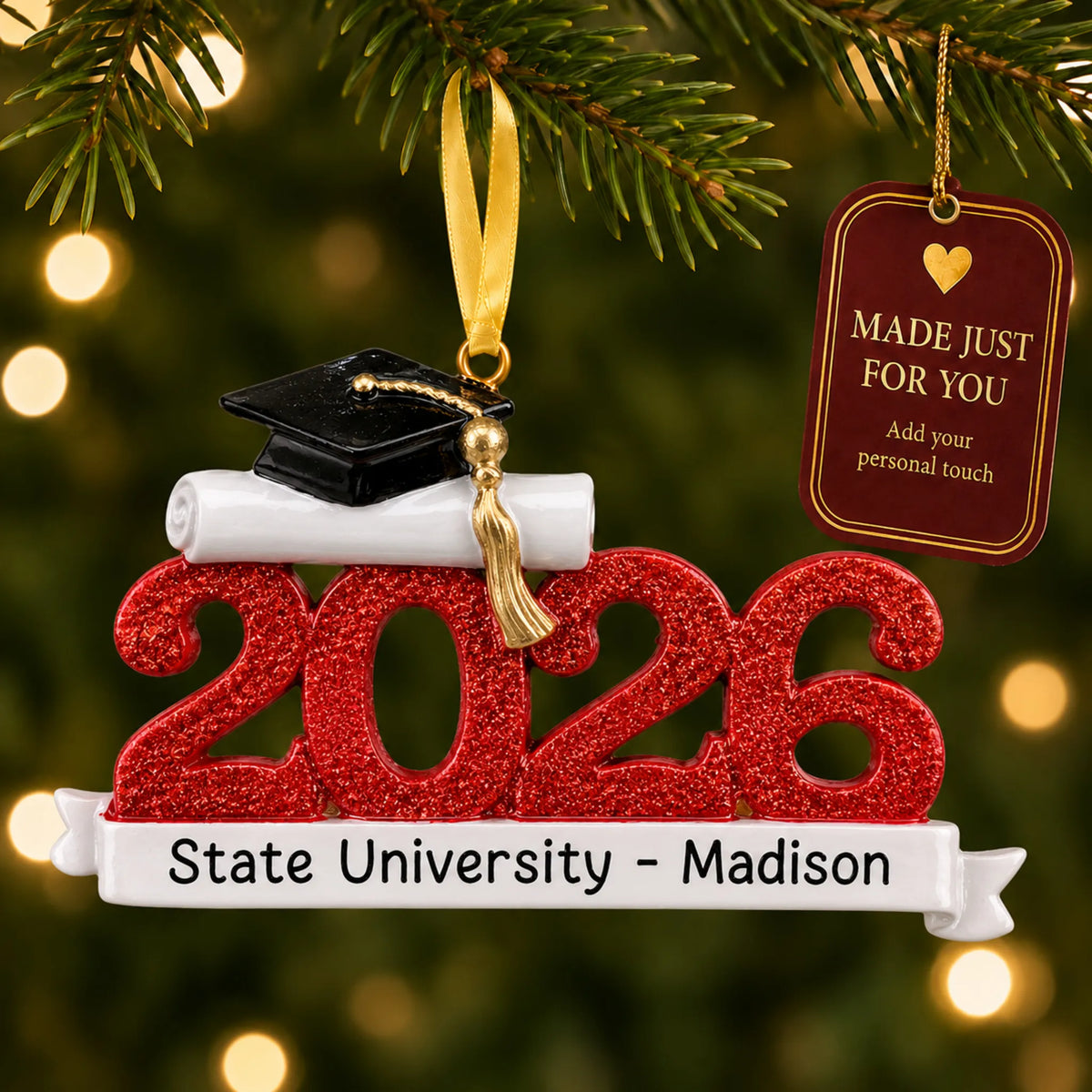 Personalized Class of 2026 red graduation Christmas ornament on a lit tree with a made-just-for-you tag