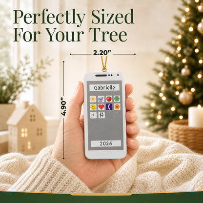 Size guide: the personalized white smartphone christmas ornament is 2.20 in wide by 4.90 in tall, shown in hand