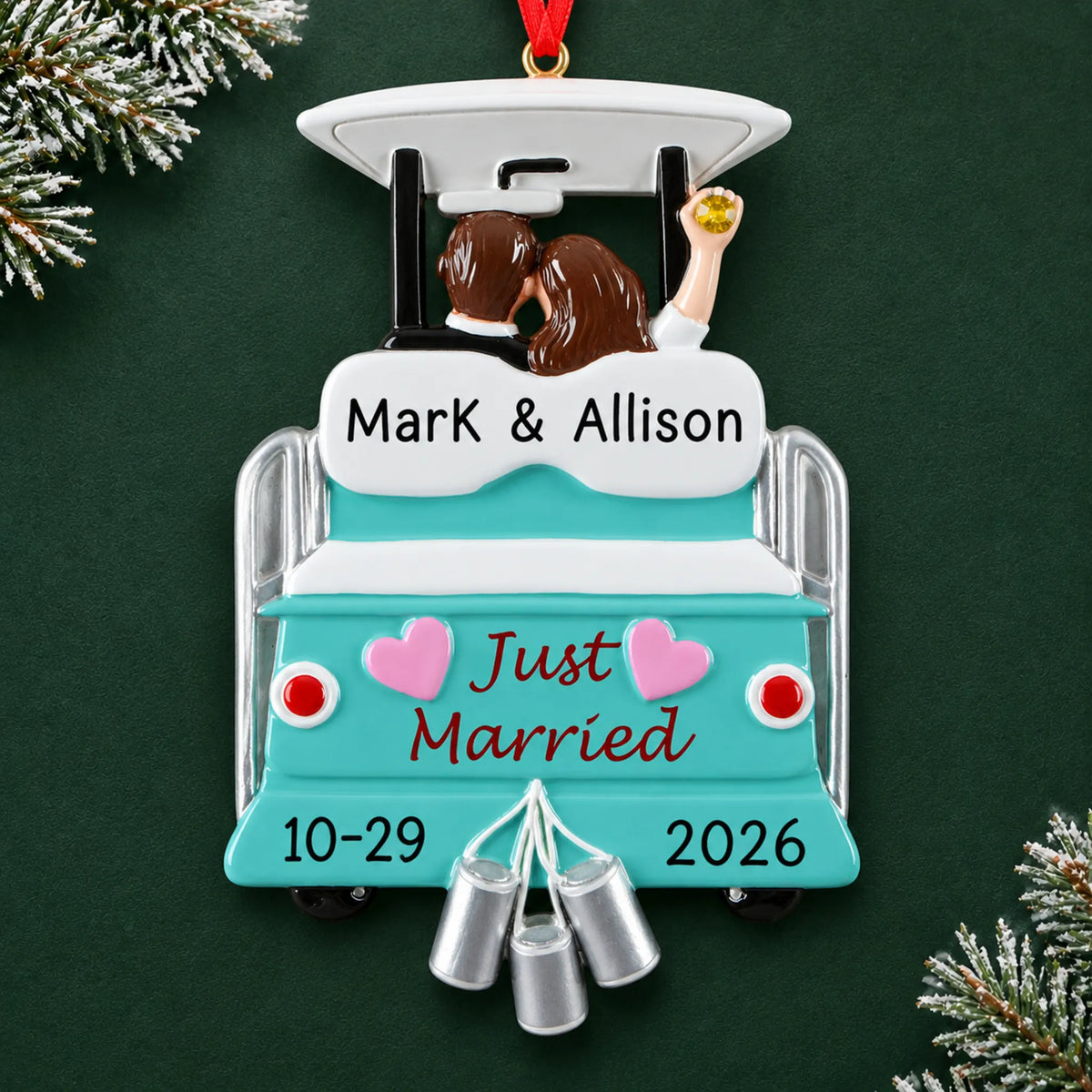 Personalized Just Married Wedding christmas ornament on a dark green pine background