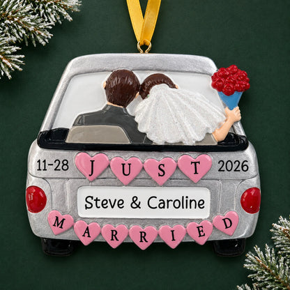 Personalized Just Married Car Silver christmas ornament on a dark green pine background