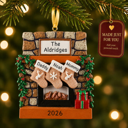 Rustic fireplace family of 3 christmas ornament hanging on a lit Christmas tree with a Made Just For You gift tag