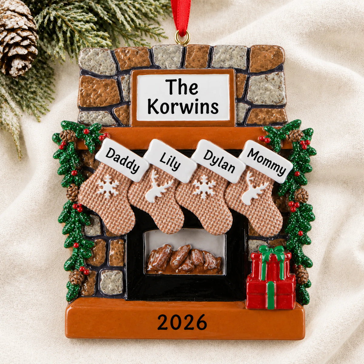 Personalized rustic fireplace family of 4 christmas ornament laid on a soft white knit blanket