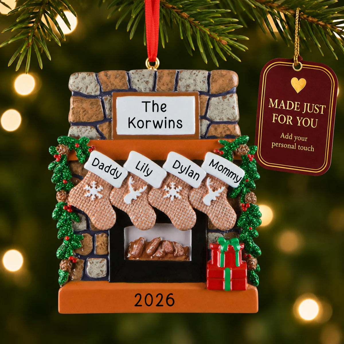 Rustic fireplace family of 4 christmas ornament hanging on a lit Christmas tree with a Made Just For You gift tag