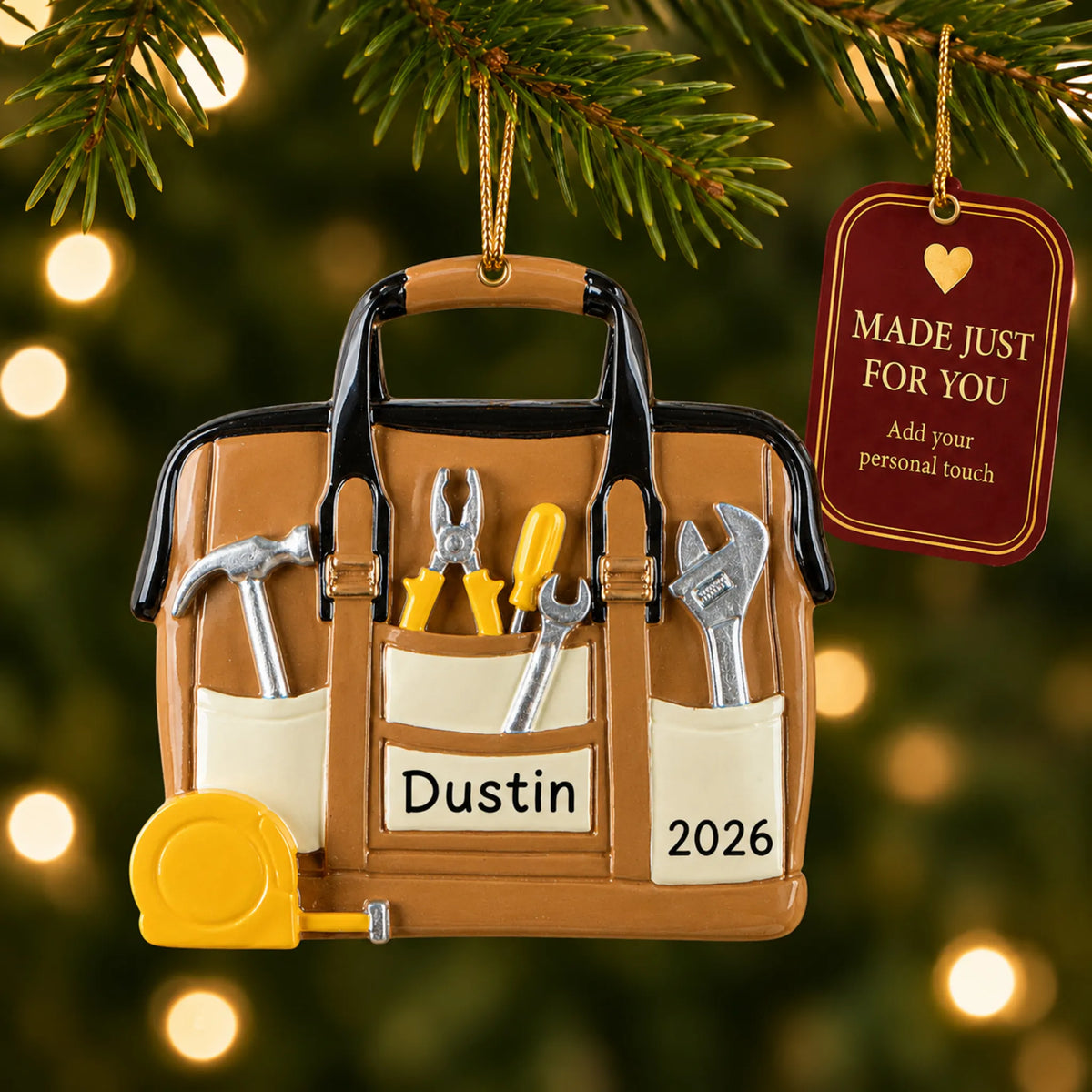 Tool bag handyman christmas ornament hanging on a lit Christmas tree with a Made Just For You gift tag