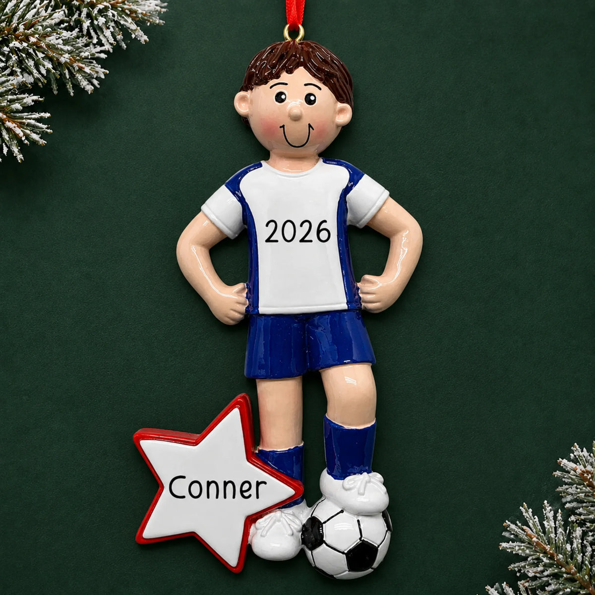 Personalized soccer all-star boy christmas ornament on a dark green pine background