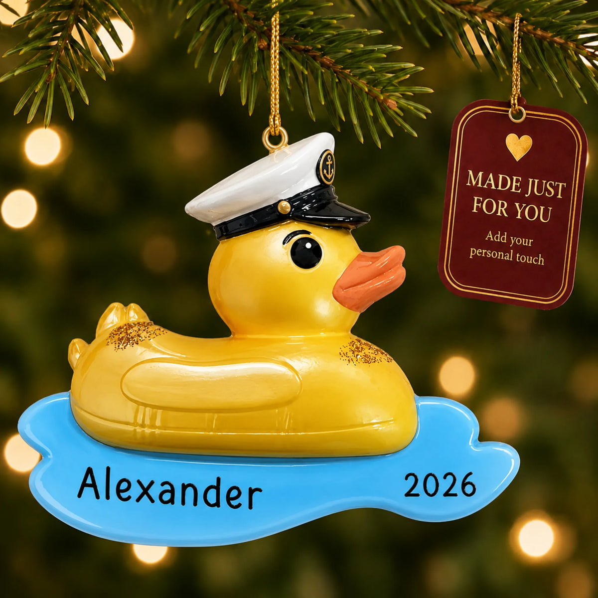 Rubber ducky floatie christmas ornament hanging on a lit Christmas tree with a Made Just For You gift tag