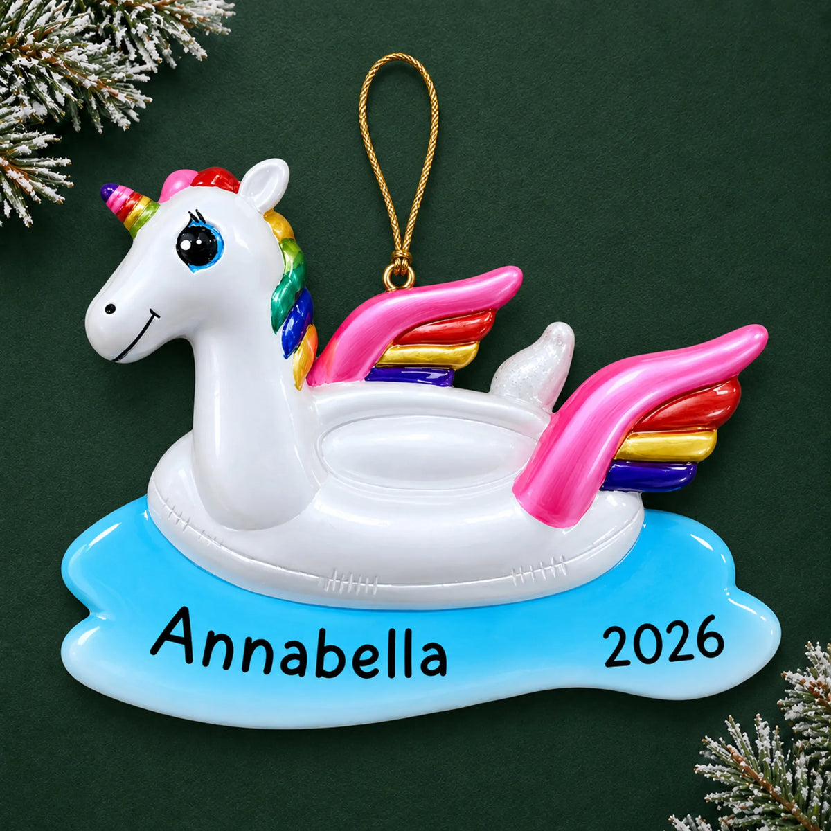 Personalized unicorn floatie christmas ornament on a dark green pine background