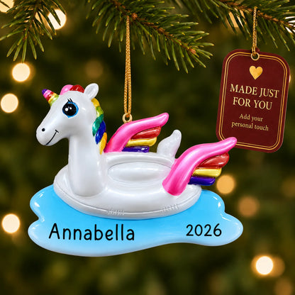 Unicorn floatie christmas ornament hanging on a lit Christmas tree with a Made Just For You gift tag