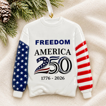 Personalized America 250 sweatshirt Christmas ornament shown on a soft white blanket