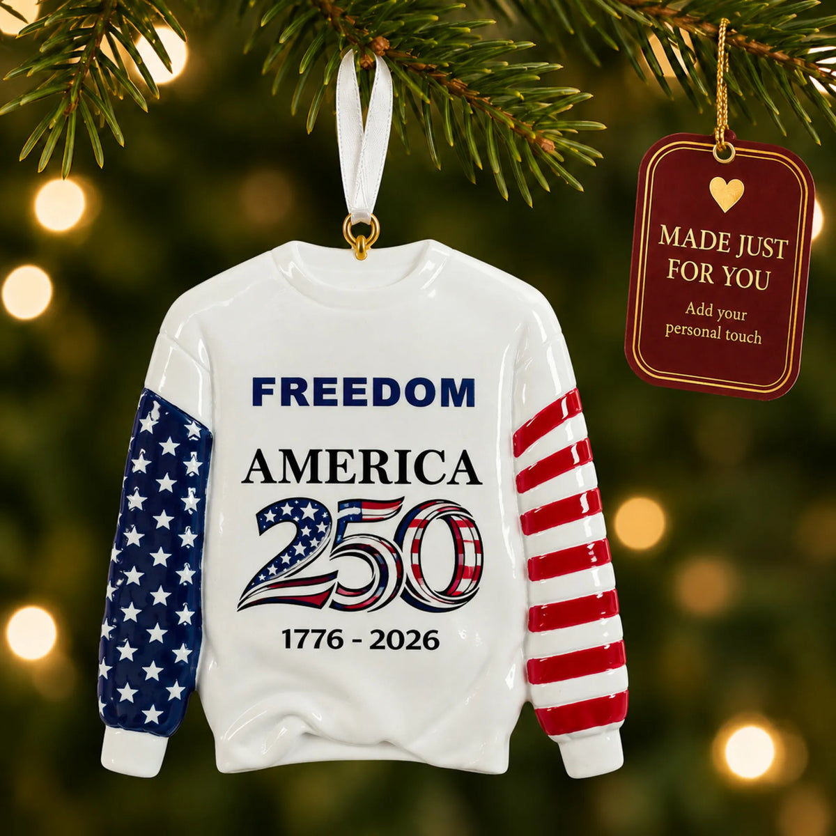 America 250 Sweatshirt christmas ornament hanging on a lit Christmas tree with a Made Just For You gift tag