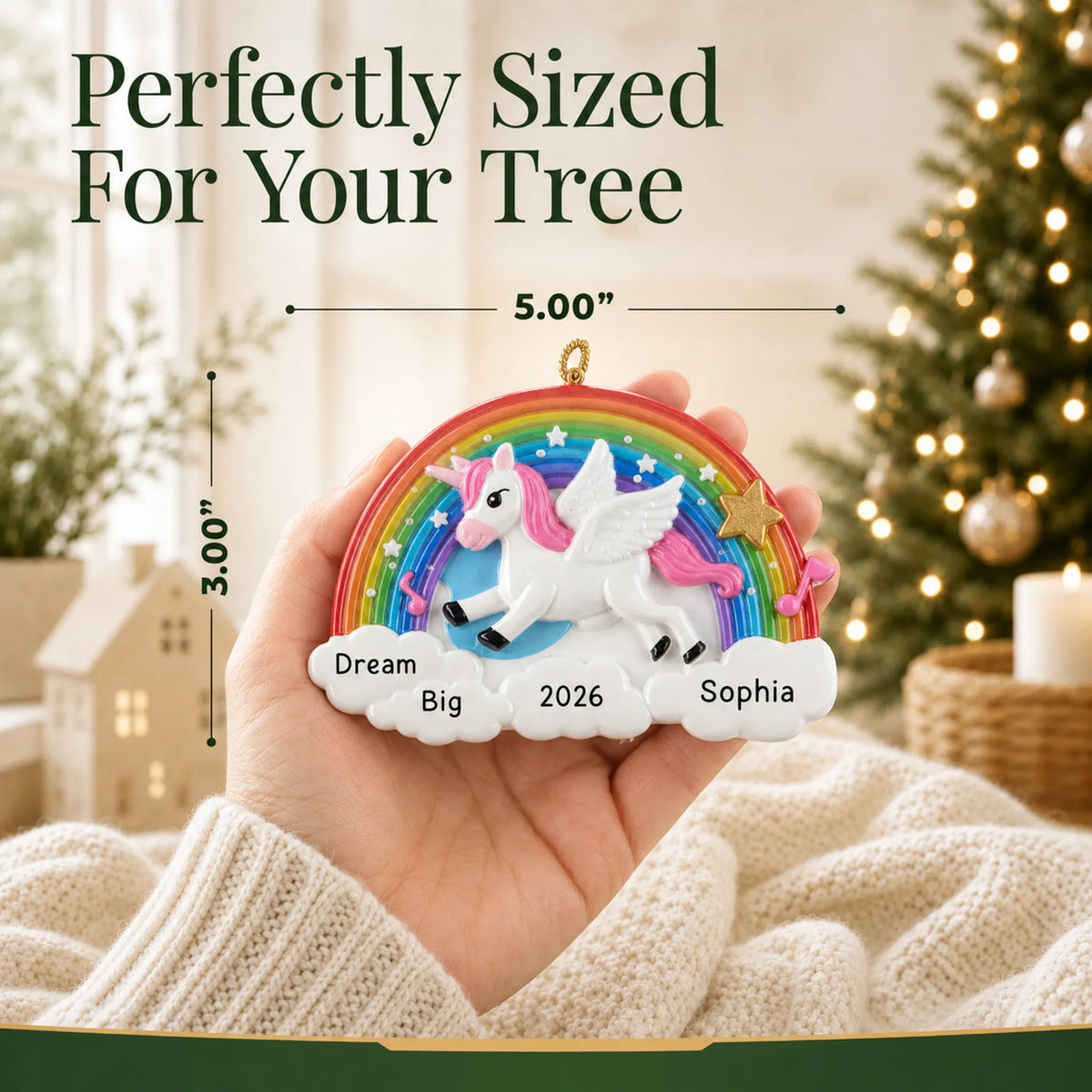 Size guide: the personalized rainbow unicorn sparkles christmas ornament is 5.00 in wide by 3.00 in tall, shown in hand