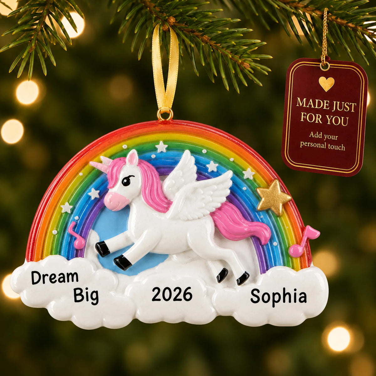 Rainbow unicorn sparkles christmas ornament hanging on a lit Christmas tree with a Made Just For You gift tag