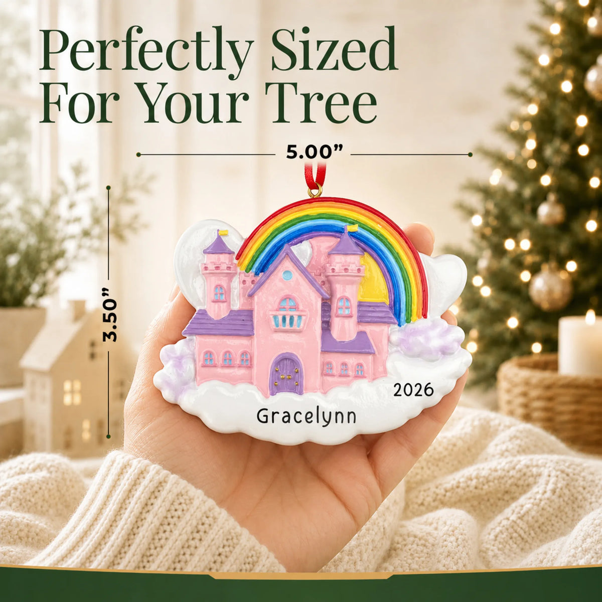 Size guide: the personalized princess castle magical rainbow christmas ornament shown in hand next to a Christmas tree