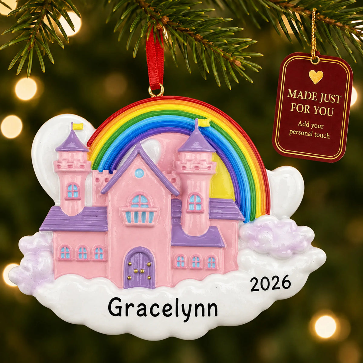 Princess castle magical rainbow christmas ornament hanging on a lit Christmas tree with a Made Just For You gift tag