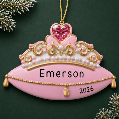 Personalized princess tiara christmas ornament on a dark green pine background
