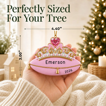 Size guide: the personalized princess tiara christmas ornament shown in hand next to a Christmas tree